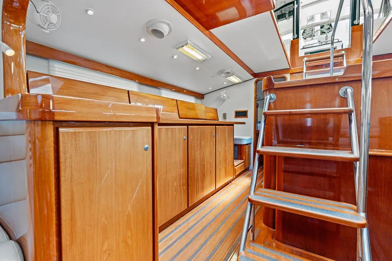 Slide: The Image of Luxurious wooden interior of 1998 Custom Kelly Archer yacht with polished cabinets and stairs. - 7
