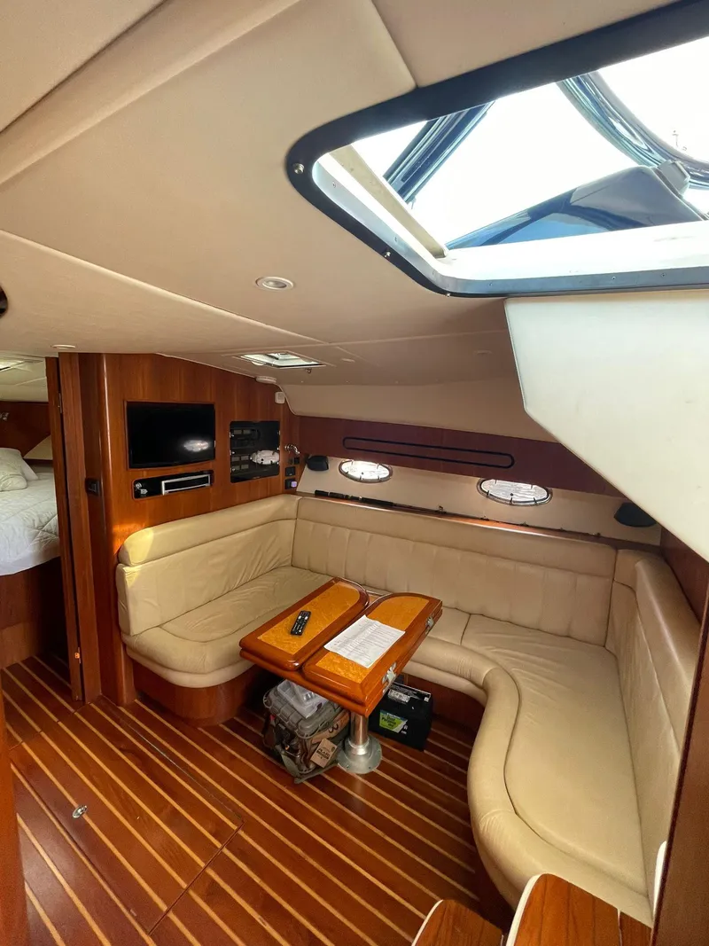 Slide: The Image of Luxurious interior of 2008 Tiara Yachts 3800 Open with leather seating and wood accents. - 12