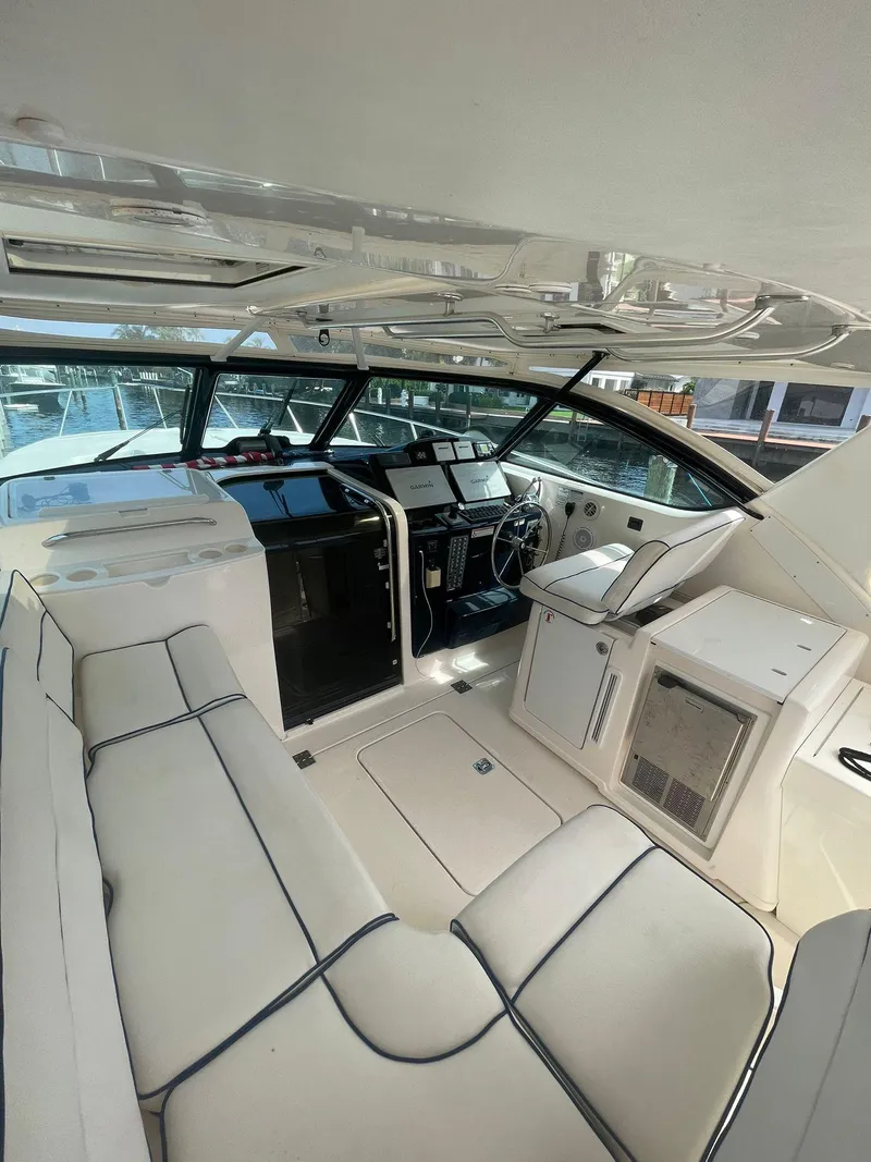 Slide: The Image of 2008 Tiara Yachts 3800 Open interior with helm, seating, and navigation equipment. - 6