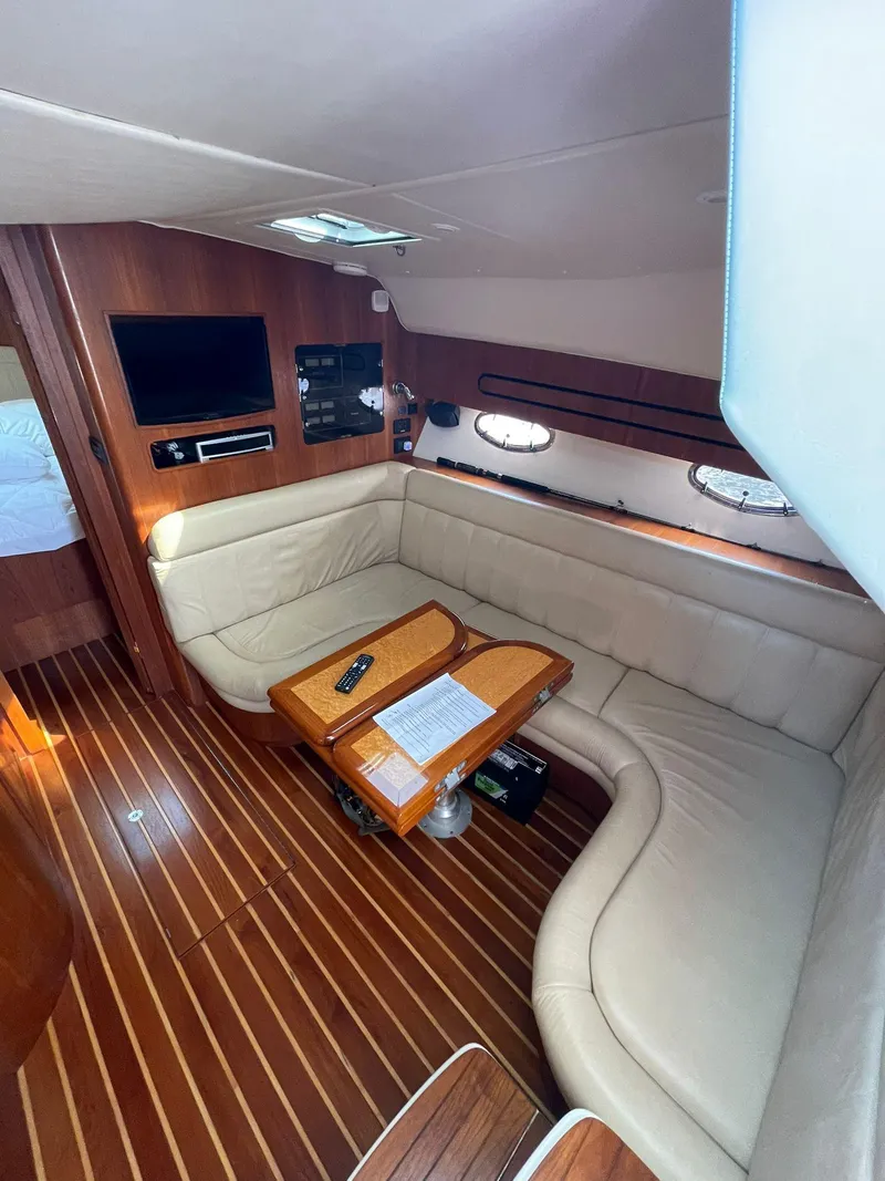 Slide: The Image of Luxurious interior of 2008 Tiara Yachts 3800 Open with leather seating and wooden accents. - 9