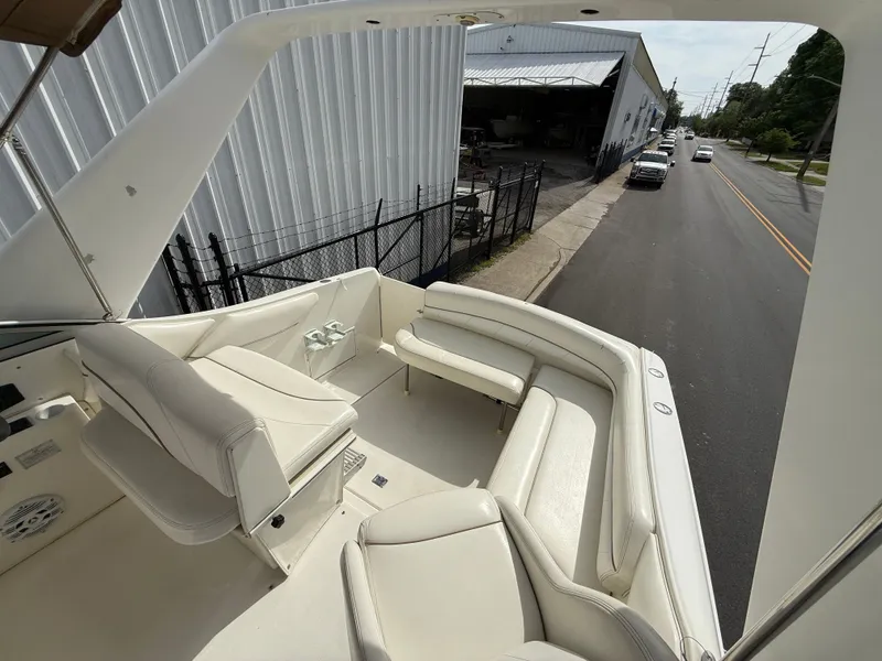 Slide: The Image of Interior of a 2001 Larson Cabrio 270 yacht with white seating. - 10