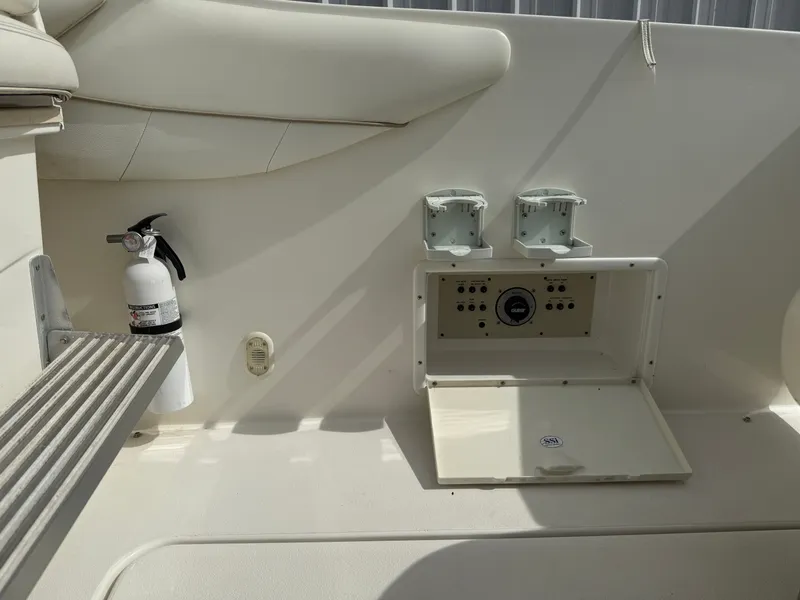 Slide: The Image of Interior of a 2001 Larson Cabrio 270 boat with fire extinguisher. - 12