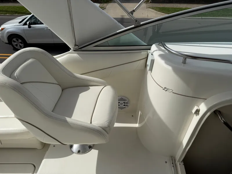 Slide: The Image of Interior of a 2001 Larson Cabrio 270 boat with seating. - 15