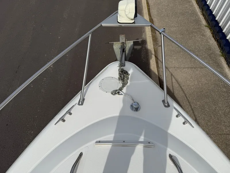 Slide: The Image of Bow of a 2001 Larson Cabrio 270 with anchor and chain. - 17