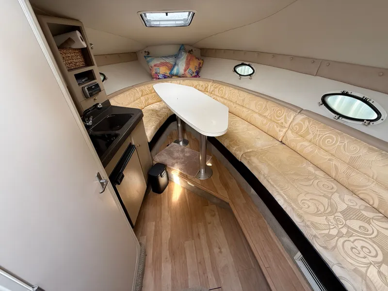 Slide: The Image of Interior of 2001 Larson Cabrio 270 yacht with elegant seating area. - 20