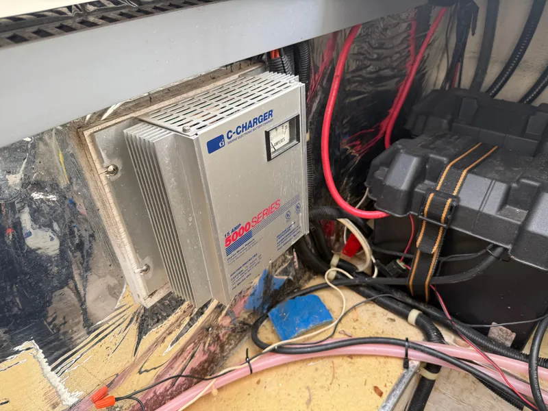 Slide: The Image of Charger in engine compartment of a 2001 Larson Cabrio 270. - 27