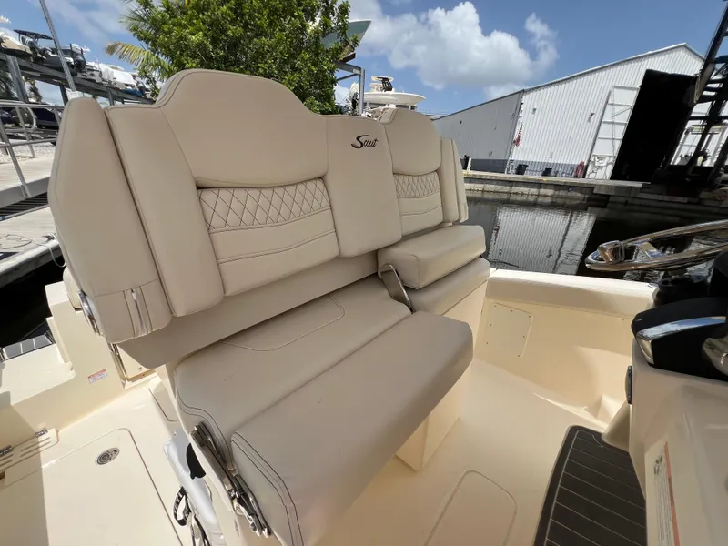 Slide: The Image of 2026 Scout 260 LXF boat interior with luxurious beige seating. - 21