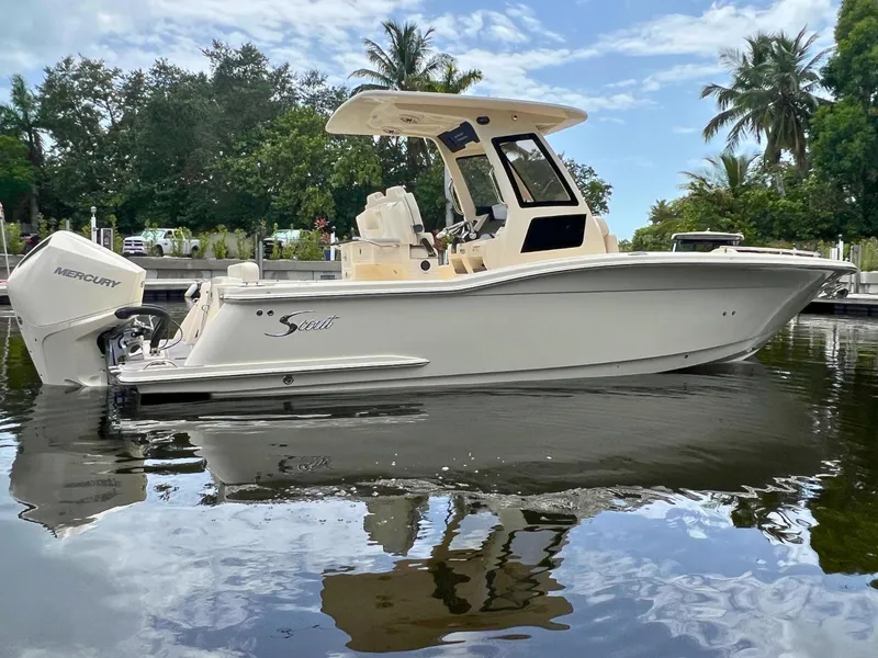Slide: The Image of 2026 Scout 260 LXF boat on water, featuring sleek design and Mercury engine. - 3