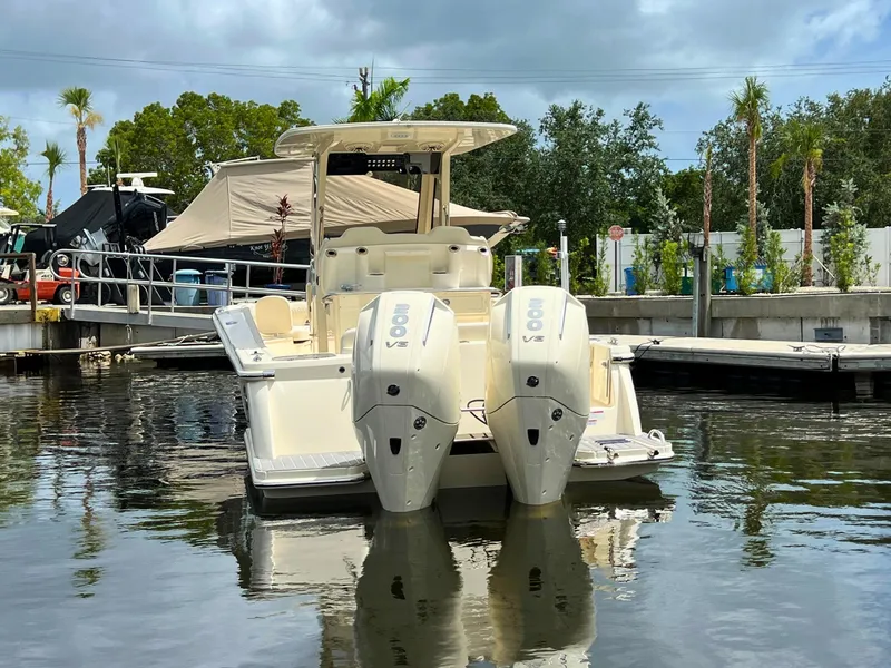 Slide: The Image of 2026 Scout 260 LXF boat docked with twin 200 V6 engines. - 6