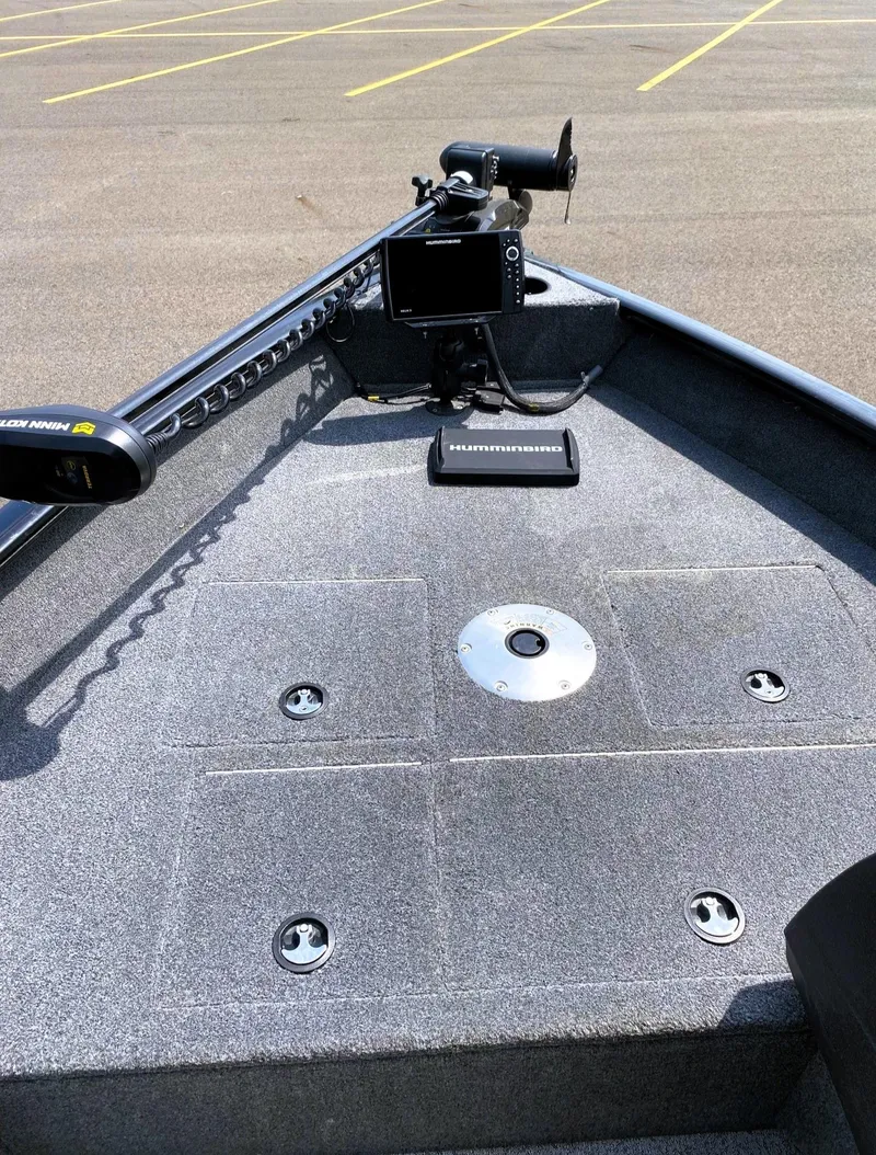Slide: The Image of 2022 Tracker Pro Guide V-16 SC boat deck with Humminbird electronics and trolling motor. - 8