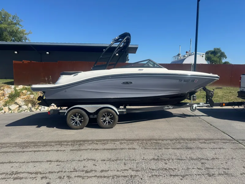 Slide: The Image of 2023 Sea Ray SPX 190 boat on trailer, parked outdoors. - 18