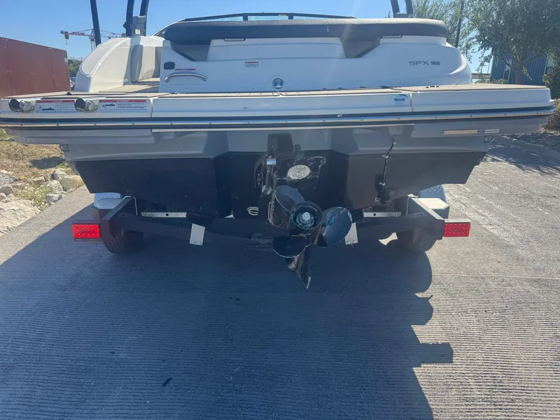 Slide: The Image of Rear view of a 2023 Sea Ray SPX 190 boat on a trailer. - 19