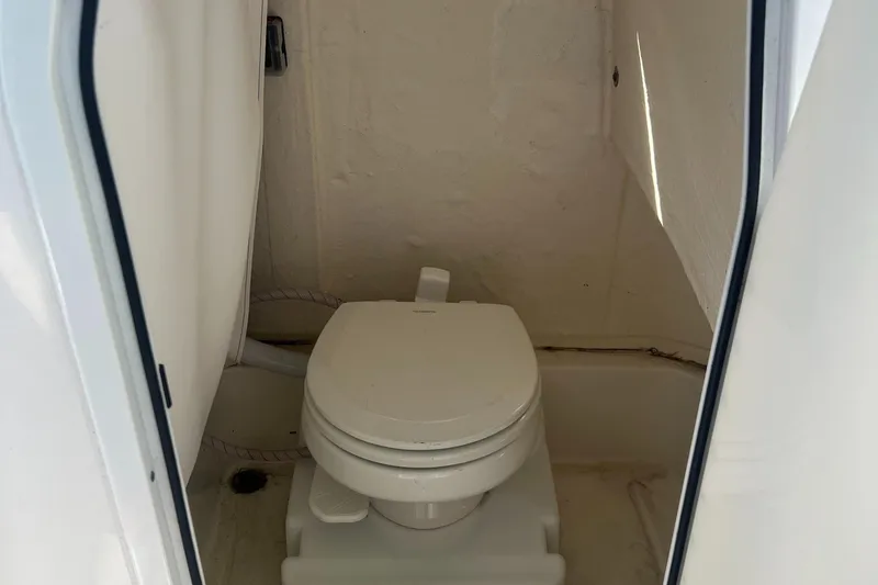 Slide: The Image of 2021 Sea Pro 219 Center Console boat toilet interior view. - 6
