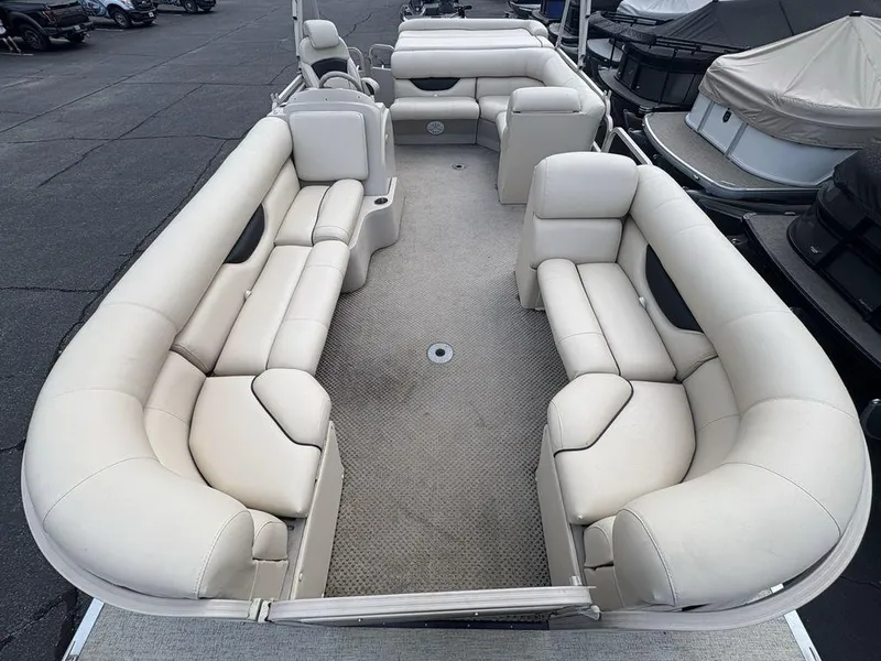 Slide: The Image of 2006 Sylvan 8522 Signature pontoon boat with spacious beige seating and carpeted deck. - 17