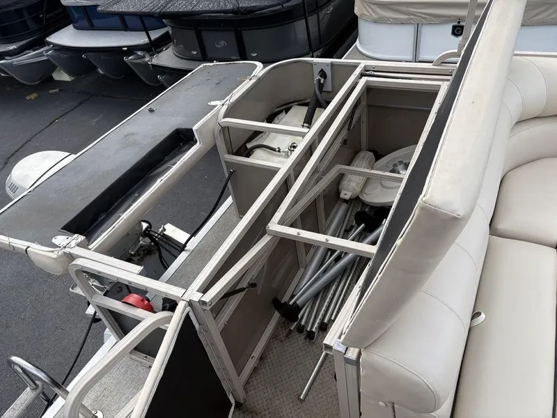 Slide: The Image of 2006 Sylvan 8522 Signature pontoon boat interior with open storage compartments. - 19