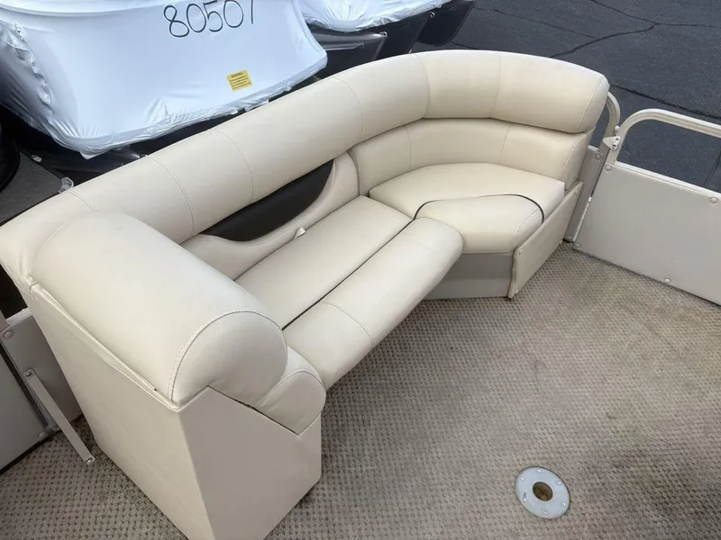 Slide: The Image of Beige seating on 2006 Sylvan 8522 Signature boat, featuring plush upholstery and spacious design. - 8