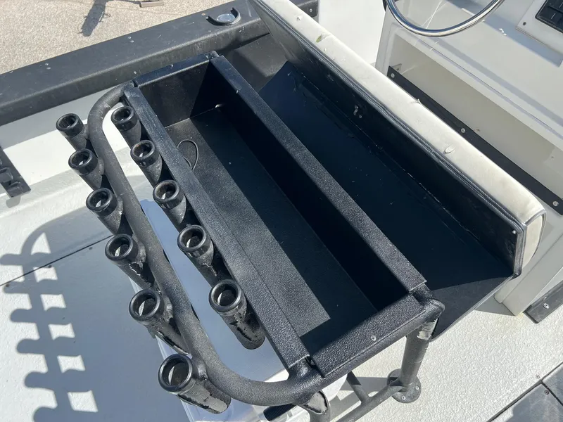 Slide: The Image of Rod holders on a 1989 Boston Whaler 23 Guardian boat deck. - 12