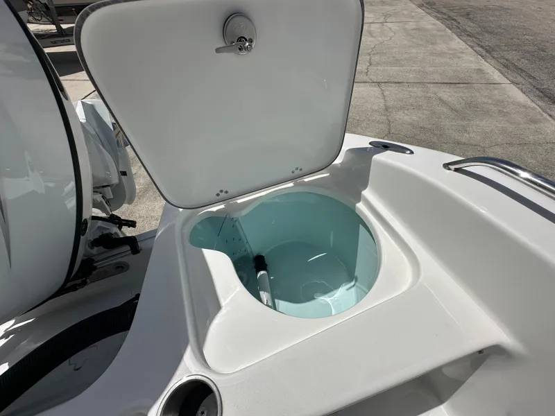 Slide: The Image of 2026 Sea Pro 202 Center Console boat with open storage compartment. - 12