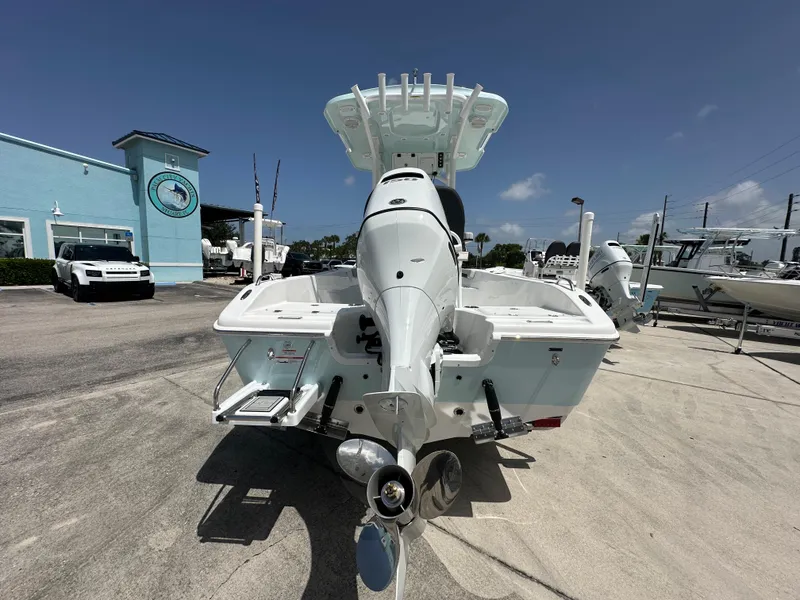 Slide: The Image of 2026 Sea Pro 202 Center Console boat with outboard motor, displayed at a dealership. - 3