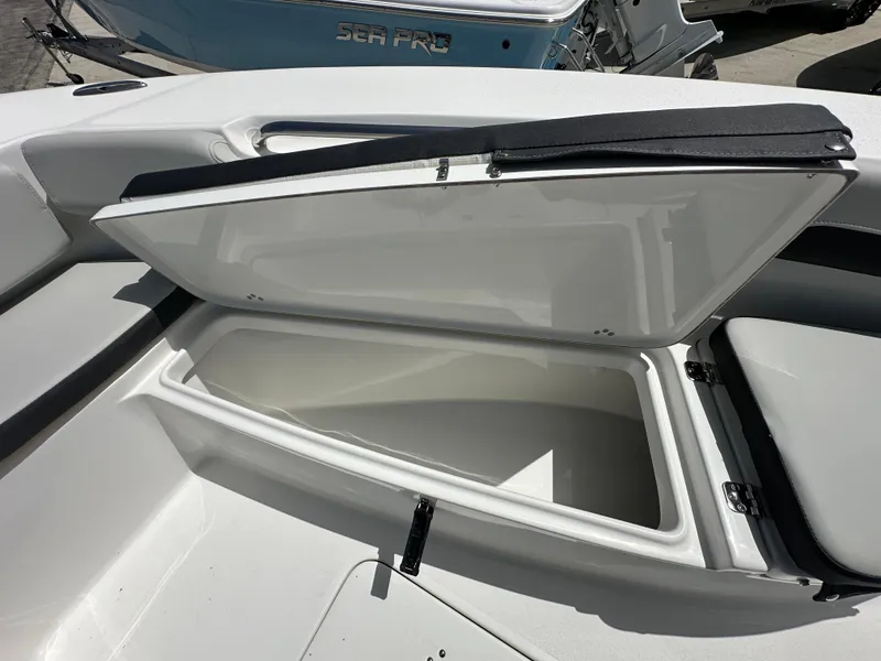 Slide: The Image of Open storage compartment on 2026 Sea Pro 202 Center Console boat. - 6