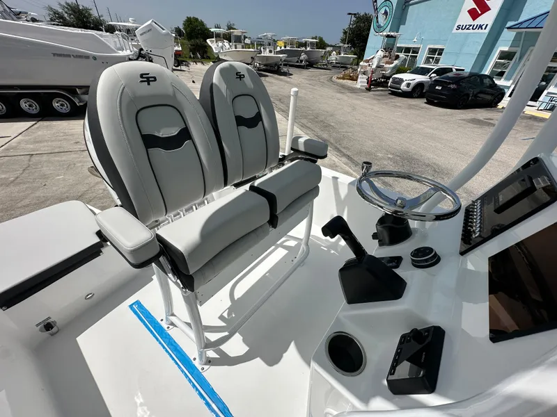 Slide: The Image of 2026 Sea Pro 202 Center Console boat interior with dual seats and steering console. - 9