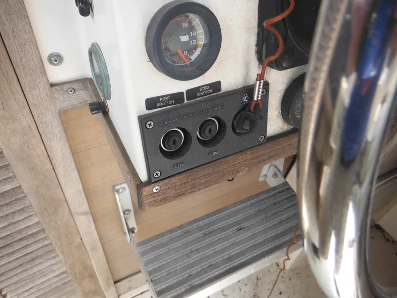 Slide: The Image of Control panel of a 1988 Grady-White Offshore 240 boat with ignition switches. - 12