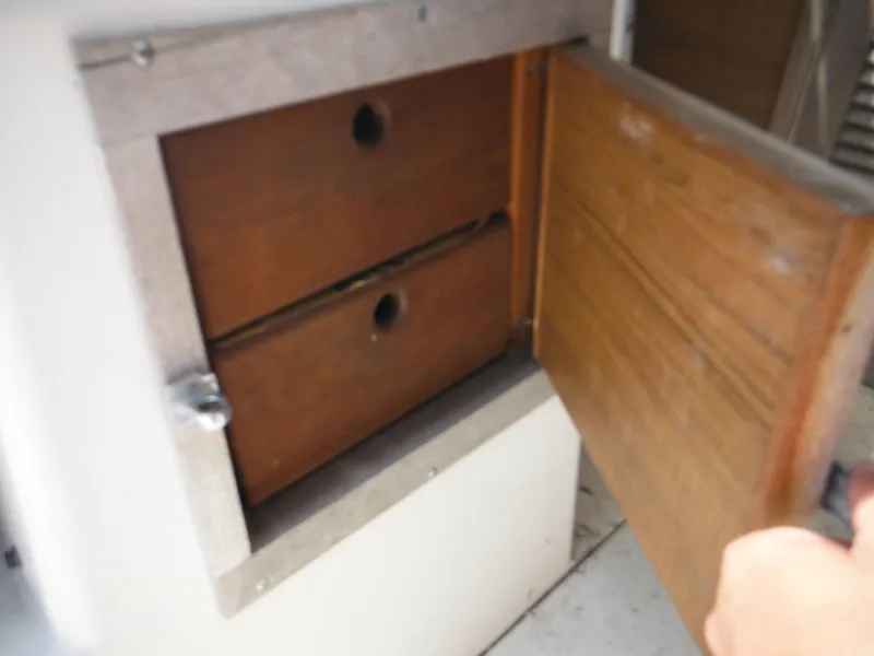 Slide: The Image of Open wooden cabinet on 1988 Grady-White Offshore 240 boat. - 20