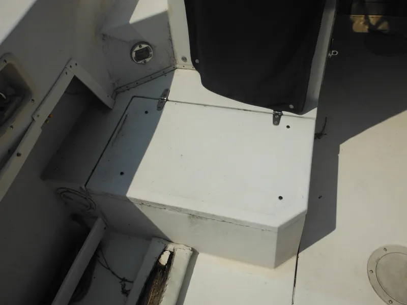 Slide: The Image of 1988 Grady-White Offshore 240 boat interior, showing seating and storage area. - 22