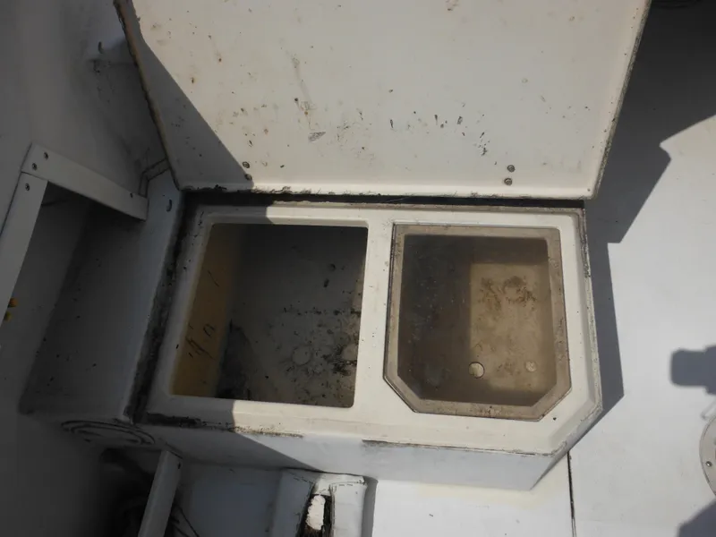 Slide: The Image of Open storage compartments on a 1988 Grady-White Offshore 240 boat. - 23