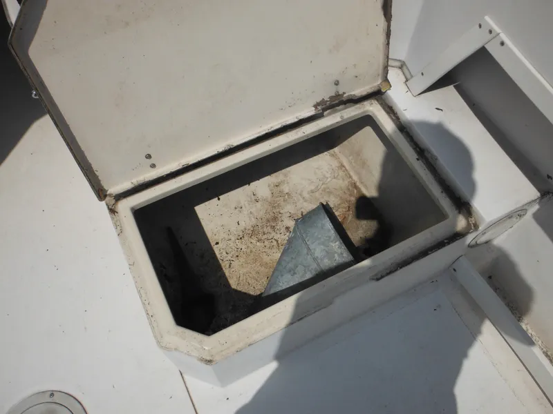 Slide: The Image of Open storage compartment on 1988 Grady-White Offshore 240 boat. - 25
