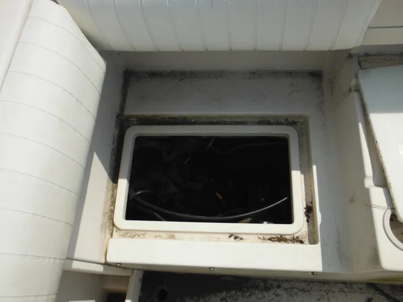 Slide: The Image of Open storage compartment on a 1988 Grady-White Offshore 240 boat. - 28