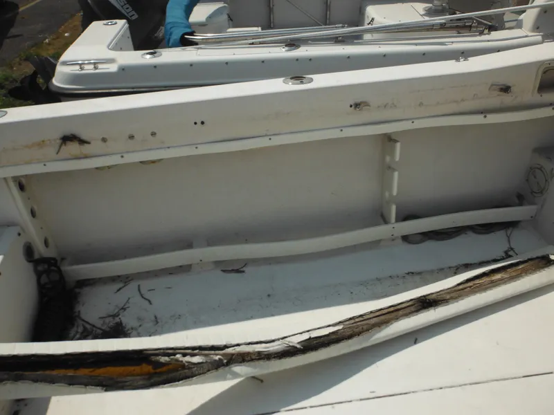 Slide: The Image of 1988 Grady-White Offshore 240 boat interior showing wear and damage. - 33