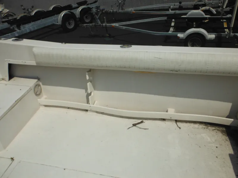 Slide: The Image of 1988 Grady-White Offshore 240 boat interior with visible trailer in background. - 34