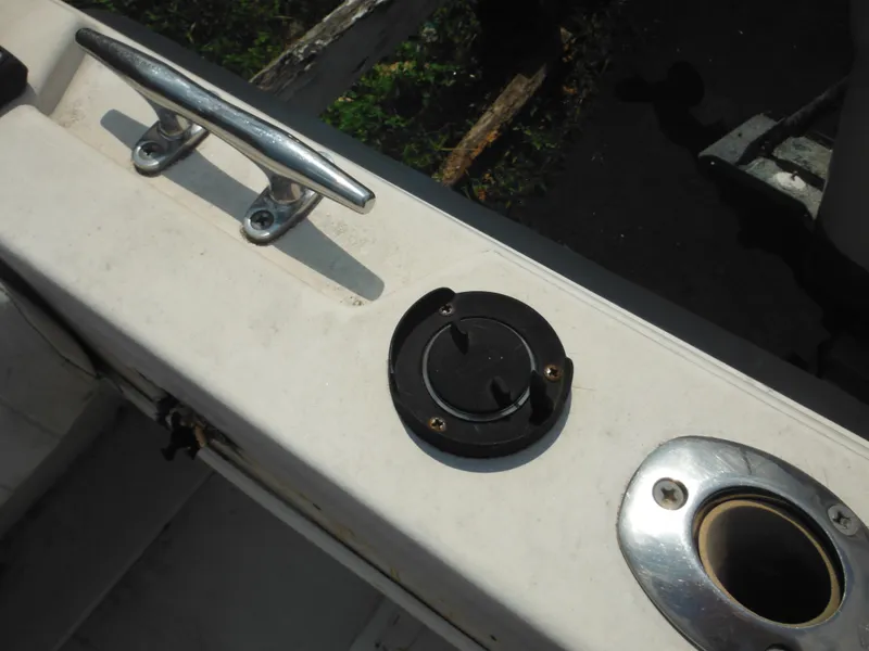 Slide: The Image of 1988 Grady-White Offshore 240 boat deck with cleat and rod holder. - 36