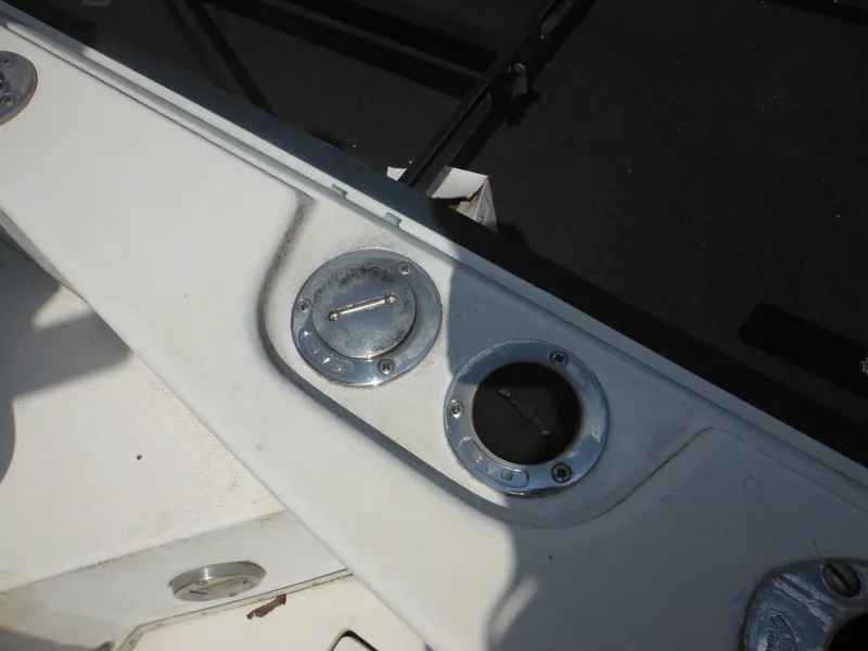 Slide: The Image of 1988 Grady-White Offshore 240 boat deck with metal fittings and shadow. - 38