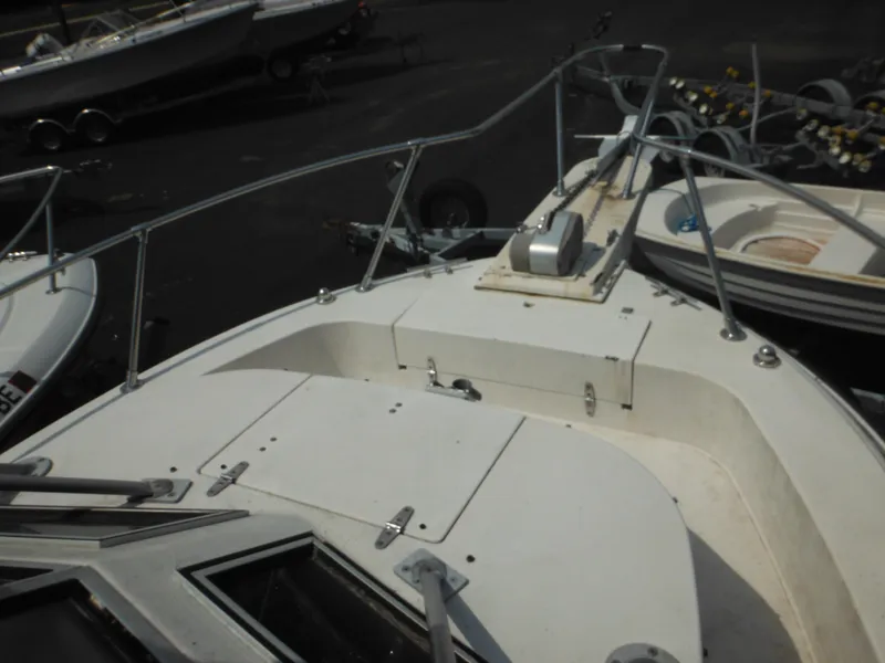 Slide: The Image of 1988 Grady-White Offshore 240 boat deck with railing and hatch. - 40