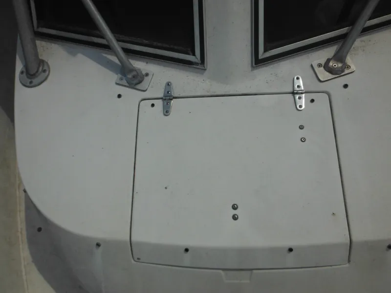 Slide: The Image of 1988 Grady-White Offshore 240 boat deck with hatch and metal fittings. - 43