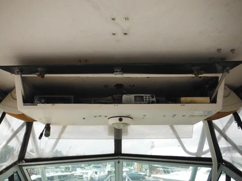 Slide: The Image of 1988 Grady-White Offshore 240 boat interior with electronic equipment storage. - 6