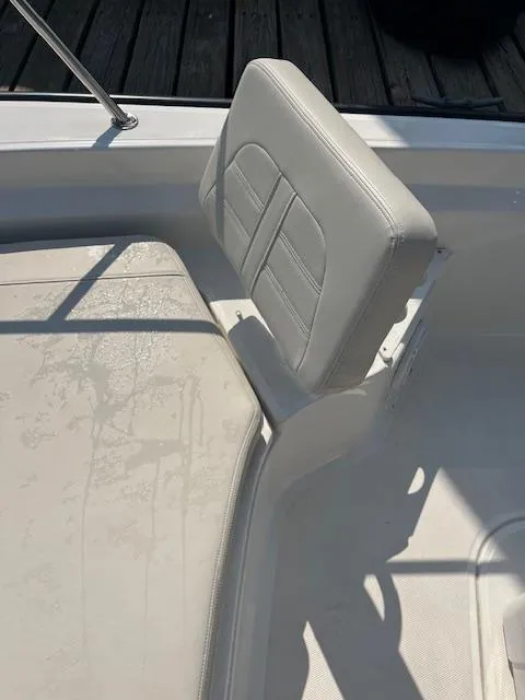 Slide: The Image of 2024 Boston Whaler 210 Montauk boat seat with sunlight and shadows. - 17