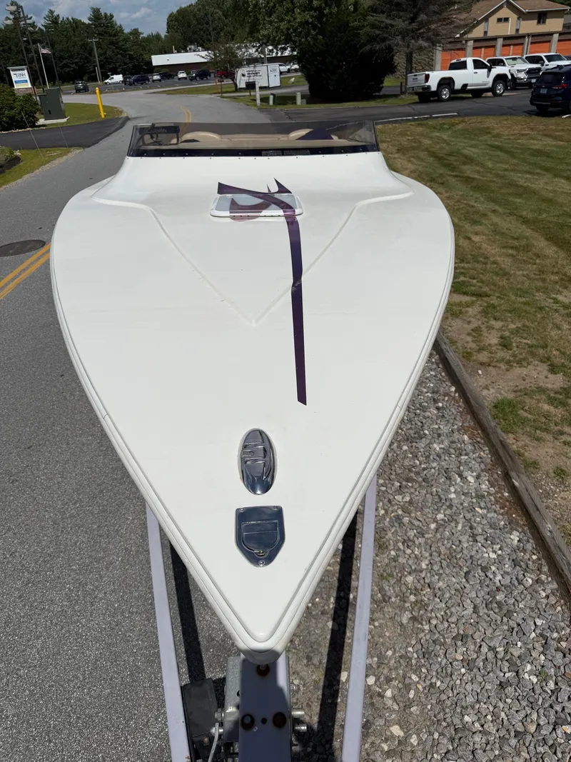 Slide: The Image of 2006 Velocity VR1 boat on trailer, parked on roadside. - 9