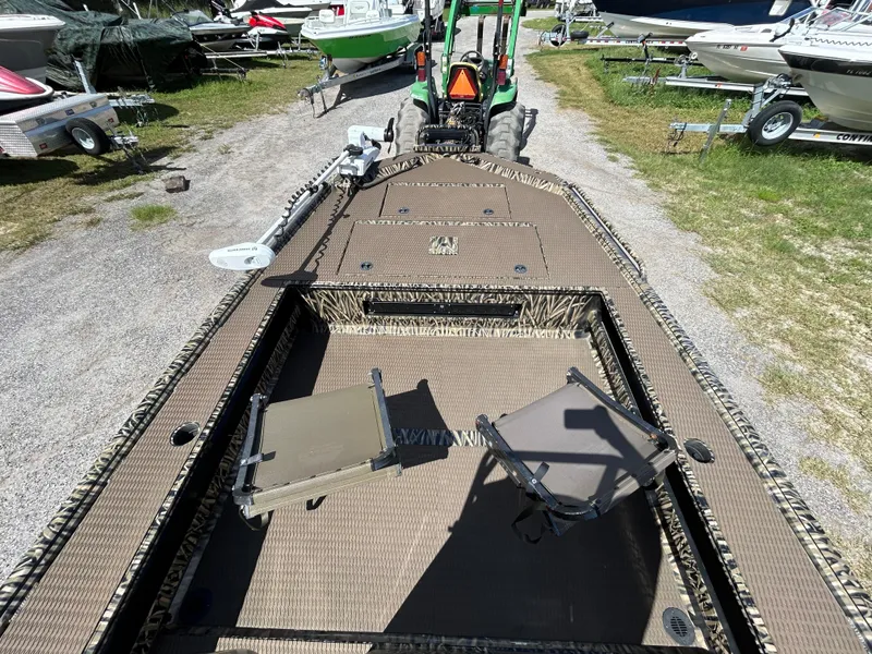 Slide: The Image of Boat interior with camouflage design, featuring seating and storage, Prodigy 2070 model, 2023. - 12