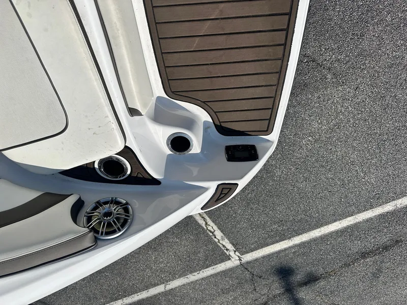 Slide: The Image of 2016 Yamaha 242 Limited S E-Series boat deck with speaker and cup holder. - 13