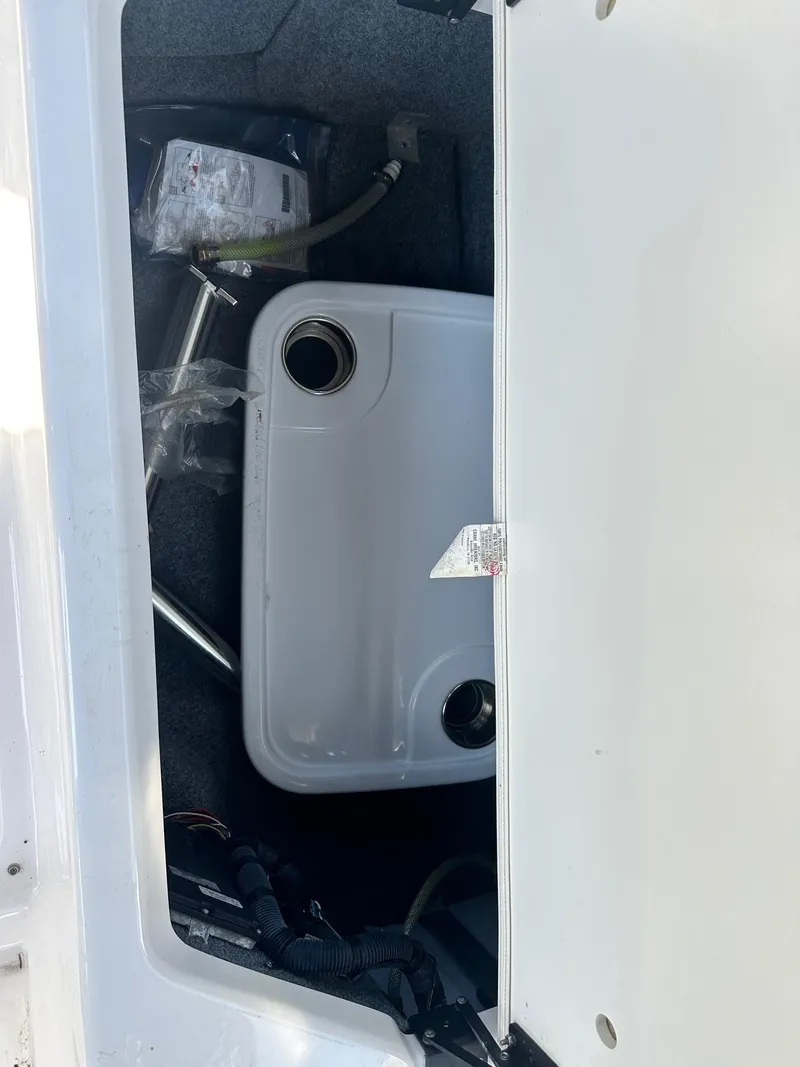 Slide: The Image of Storage compartment of a 2016 Yamaha Boats 242 Limited S E-Series, showing interior components. - 20