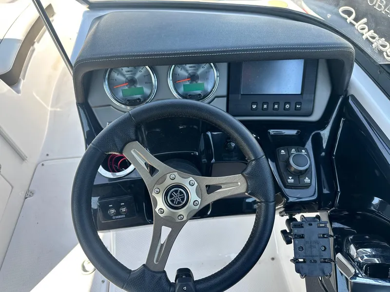 Slide: The Image of 2016 Yamaha Boats 242 Limited S E-Series dashboard with steering wheel and controls. - 21