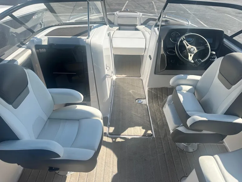 Slide: The Image of 2016 Yamaha Boats 242 Limited S E-Series interior with dual captain's chairs and steering console. - 22