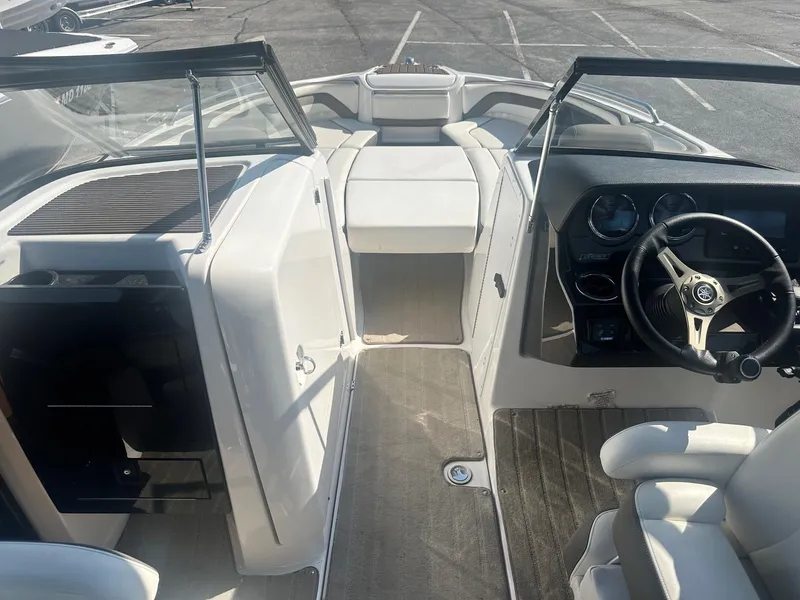 Slide: The Image of 2016 Yamaha Boats 242 Limited S E-Series interior with steering wheel and seating. - 24