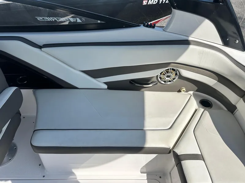 Slide: The Image of 2016 Yamaha Boats 242 Limited S E-Series interior seating with speaker and cup holder. - 26