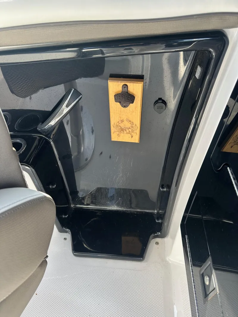 Slide: The Image of Interior of 2016 Yamaha Boats 242 Limited S E-Series with wooden bottle opener. - 30