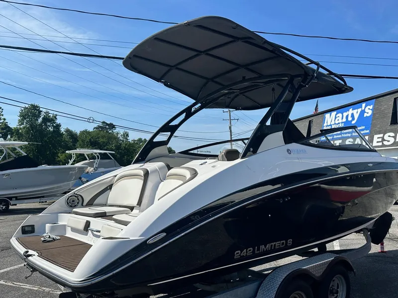 Slide: The Image of 2016 Yamaha Boats 242 Limited S E-Series on trailer, sleek design, outdoor display. - 5
