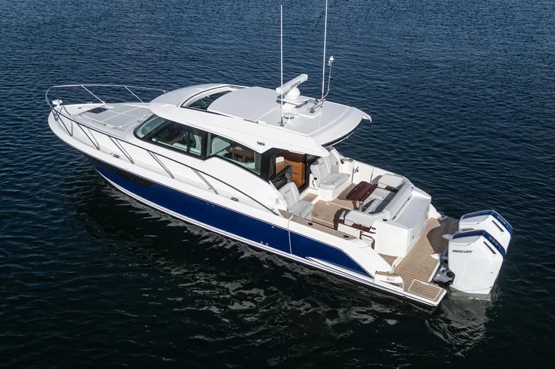 The Image of 2026 Tiara Yachts 43LE luxury boat on open water, featuring sleek design and modern amenities. - 0